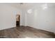 Bright bedroom with hardwood floors, ceiling fan, and adjacent bath for easy access and privacy at 6620 E Stallion Rd, Paradise Valley, AZ 85253