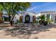 Stunning property featuring a beautiful iron gate and stone accents on a meticulously landscaped lot at 6620 E Stallion Rd, Paradise Valley, AZ 85253