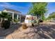 Elegant home showcasing large windows, stone accents, and meticulously maintained landscaping at 6620 E Stallion Rd, Paradise Valley, AZ 85253