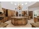Gourmet kitchen featuring a large island, custom cabinets, and stainless steel appliances at 6620 E Stallion Rd, Paradise Valley, AZ 85253