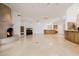 Open living space with travertine floors, fireplace, built-in cabinets and lots of natural light at 6620 E Stallion Rd, Paradise Valley, AZ 85253