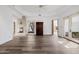 Expansive living room with stone fireplace, hardwood floors, and lots of natural light at 6620 E Stallion Rd, Paradise Valley, AZ 85253