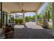 Spacious outdoor patio with a fireplace and a view of the pool, perfect for entertaining guests at 6620 E Stallion Rd, Paradise Valley, AZ 85253