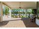 Charming outdoor patio with a ceiling fan, a fireplace, and a landscaped backyard at 6620 E Stallion Rd, Paradise Valley, AZ 85253