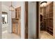Wine cellar area with a wet bar, glass door, and extensive wine storage at 6620 E Stallion Rd, Paradise Valley, AZ 85253