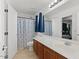 Bright bathroom with a large mirror, modern vanity, and shower-tub combination at 1264 E Walnut Rd, Gilbert, AZ 85298