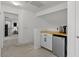 Hallway nook with a mini fridge and cabinet at 1264 E Walnut Rd, Gilbert, AZ 85298