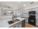 Bright kitchen featuring quartz countertops, stainless appliances, and a stylish kitchen island at 1264 E Walnut Rd, Gilbert, AZ 85298