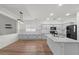 Spacious kitchen featuring ample counter space, sleek black appliances, and an island, ideal for entertaining at 1264 E Walnut Rd, Gilbert, AZ 85298