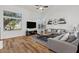 Comfortable living room with ample natural light, modern decor, and wood floors at 1264 E Walnut Rd, Gilbert, AZ 85298