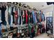Spacious walk-in closet with ample storage and organization for shoes, clothes, and accessories at 1264 E Walnut Rd, Gilbert, AZ 85298