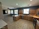 Spacious kitchen featuring stainless appliances, tile flooring, and ample countertop space with a breakfast bar at 1542 E Chaparral Pl, Casa Grande, AZ 85122