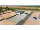 Aerial view showcasing a single-story home, green lawn, and ample parking in a spacious setting at 18083 W Amber Dr, Goodyear, AZ 85338