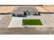 New construction home with a green lawn and a long driveway leading to a three-car garage at 18083 W Amber Dr, Goodyear, AZ 85338