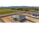 Expansive aerial view of a modern home with a large lot, showcasing its desert surroundings and mountain views at 18083 W Amber Dr, Goodyear, AZ 85338