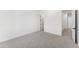 Bedroom with plush carpet, neutral walls and a door to the hallway at 18083 W Amber Dr, Goodyear, AZ 85338