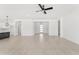 Bright and spacious living area with tile flooring, open floor plan, and kitchen island at 18083 W Amber Dr, Goodyear, AZ 85338