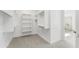 Walk-in closet has custom shelves and leads to the main ensuite at 18083 W Amber Dr, Goodyear, AZ 85338
