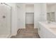 Bathroom features a glass shower, tiled floor and a vanity sink at 3409 E Alexander Dr, San Tan Valley, AZ 85143