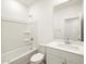 Bright bathroom featuring a shower-tub combo, modern vanity, and ample lighting at 3409 E Alexander Dr, San Tan Valley, AZ 85143