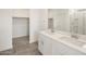 Bathroom features a glass shower, tiled floor, walk-in closet and double vanity at 3409 E Alexander Dr, San Tan Valley, AZ 85143