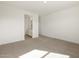 Bedroom with light-colored carpet with a view of the bathroom at 3409 E Alexander Dr, San Tan Valley, AZ 85143