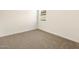 Cozy bedroom featuring neutral carpet, white walls, and a bright window at 3409 E Alexander Dr, San Tan Valley, AZ 85143