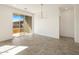Open dining area with sliding glass doors and modern chandelier at 3409 E Alexander Dr, San Tan Valley, AZ 85143