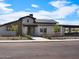 Modern home exterior featuring clean lines, xeriscaped front yard, and covered patio at 3409 E Alexander Dr, San Tan Valley, AZ 85143