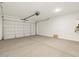 Spacious two car garage with automatic door and lighting fixture at 3409 E Alexander Dr, San Tan Valley, AZ 85143
