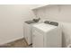 The laundry room features a modern washer and dryer, along with white shelving at 3409 E Alexander Dr, San Tan Valley, AZ 85143