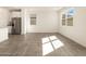 Open living area with modern appliances, tile floors, and ample natural light at 3409 E Alexander Dr, San Tan Valley, AZ 85143