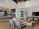 Inviting living area with comfortable seating, an open layout, and a modern kitchen in the background at 3409 E Alexander Dr, San Tan Valley, AZ 85143