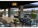 Outdoor patio area with stylish seating, pergola, and a view of the playground and community at 3409 E Alexander Dr, San Tan Valley, AZ 85143