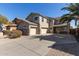 Stunning two-story home featuring a three-car garage and attractive desert landscaping at 8415 S 47Th Ln, Laveen, AZ 85339