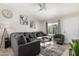 Bright living room with sectional sofa and large windows at 3646 N 69Th Ave # 60, Phoenix, AZ 85033