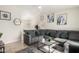 Spacious living room featuring a sectional sofa and decorative accents at 3646 N 69Th Ave # 60, Phoenix, AZ 85033
