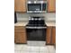 The kitchen is equipped with stainless steel appliances and light tan countertops at 2402 E 5Th St # 1429, Tempe, AZ 85288