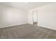 Well-lit bedroom featuring plush carpeting and neutral wall color at 3668 E Alexander Dr, San Tan Valley, AZ 85143