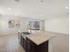 Kitchen island featuring counter seating, stainless steel appliances, and recessed lighting at 3668 E Alexander Dr, San Tan Valley, AZ 85143