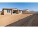 Large backyard with new home and block wall at 36853 W La Paz St, Maricopa, AZ 85138