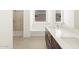 Modern bathroom with double sinks and a shower at 36853 W La Paz St, Maricopa, AZ 85138