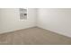 Simple bedroom with neutral walls and carpet at 36853 W La Paz St, Maricopa, AZ 85138
