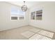 Bright dining room with large windows at 36853 W La Paz St, Maricopa, AZ 85138