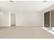 Living room with sliding glass doors to backyard at 36853 W La Paz St, Maricopa, AZ 85138