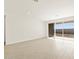 Living area featuring sliding doors and backyard access at 36853 W La Paz St, Maricopa, AZ 85138