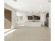 Open concept living room with kitchen access at 36853 W La Paz St, Maricopa, AZ 85138