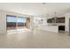 Spacious living area with kitchen and backyard views at 36853 W La Paz St, Maricopa, AZ 85138