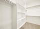 Spacious walk-in closet with ample shelving at 36853 W La Paz St, Maricopa, AZ 85138