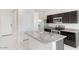 Beautiful kitchen featuring a center island, stainless steel appliances, and plenty of cabinet space at 38125 W Excussare Way, Maricopa, AZ 85138
